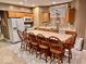 Cozy basement kitchen with island and wooden cabinetry at 5300 W Autumn Springs Ct, Muncie, IN 47304