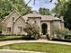 Brick two-story house with a large front yard and landscaping at 5300 W Autumn Springs Ct, Muncie, IN 47304