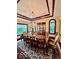 Bright dining room features a chandelier, hardwood floors and large windows at 5300 W Autumn Springs Ct, Muncie, IN 47304
