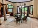 Breakfast area with glass table and chairs, and access to backyard at 5300 W Autumn Springs Ct, Muncie, IN 47304