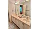 Bathroom with a double vanity and large mirror at 5300 W Autumn Springs Ct, Muncie, IN 47304
