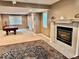 Finished basement recreation area with a pool table and fireplace at 5300 W Autumn Springs Ct, Muncie, IN 47304