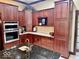 Island kitchen with granite countertops and stainless steel appliances at 5300 W Autumn Springs Ct, Muncie, IN 47304