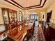 Formal dining room with a large table, chandelier, and built-in hutch at 5300 W Autumn Springs Ct, Muncie, IN 47304