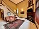 Elegant living room with fireplace and hardwood floors at 5300 W Autumn Springs Ct, Muncie, IN 47304