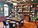 Home office with built-in bookshelves and a large desk at 5300 W Autumn Springs Ct, Muncie, IN 47304