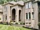 Large brick house with landscaped yard and entryway at 5300 W Autumn Springs Ct, Muncie, IN 47304