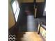 Wooden staircase with dark wood paneling at 3358 Ruckle St, Indianapolis, IN 46205