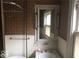 Small bathroom with vintage tile, sink, and medicine cabinet at 3358 Ruckle St, Indianapolis, IN 46205