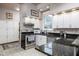 Modern kitchen with stainless steel appliances and granite countertops at 646 E 9Th St, Indianapolis, IN 46202