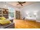 Hardwood floors, sectional sofa and built-in shelving at 646 E 9Th St, Indianapolis, IN 46202