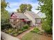Charming house with a well-manicured front yard and brick pathway at 646 E 9Th St, Indianapolis, IN 46202