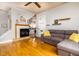 Fireplace, hardwood floors, and view into kitchen at 646 E 9Th St, Indianapolis, IN 46202