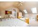 Bright attic bedroom with ensuite bathroom and skylights at 646 E 9Th St, Indianapolis, IN 46202