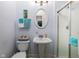 Clean bathroom with pedestal sink and shower at 646 E 9Th St, Indianapolis, IN 46202