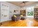 Spacious living room with hardwood floors, a comfy couch and built-in shelving at 646 E 9Th St, Indianapolis, IN 46202