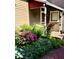 Landscaped garden with flowering plants and brick walkway at 646 E 9Th St, Indianapolis, IN 46202