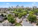 Aerial view showcasing home and surrounding neighborhood, with city skyline in the background at 646 E 9Th St, Indianapolis, IN 46202