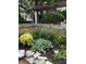 Landscaped garden with colorful flowers, shrubs and pergola at 646 E 9Th St, Indianapolis, IN 46202