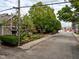 View of street with home and landscaping, showing neighborhood character at 646 E 9Th St, Indianapolis, IN 46202