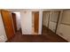 Bedroom with mirrored closet and access to bathroom at 4013 N Audubon Rd, Indianapolis, IN 46226