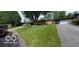 Brick ranch home with a large tree and well-kept lawn at 4013 N Audubon Rd, Indianapolis, IN 46226
