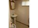 Small basement bathroom with pedestal sink and toilet at 4013 N Audubon Rd, Indianapolis, IN 46226