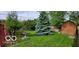 Backyard with shed, picnic table, and bird bath at 4013 N Audubon Rd, Indianapolis, IN 46226