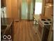 Bright kitchen featuring wood-look floors and ample cabinetry at 4013 N Audubon Rd, Indianapolis, IN 46226