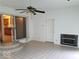 Bright sunroom featuring tiled floors, fireplace, and sliding glass doors at 4013 N Audubon Rd, Indianapolis, IN 46226