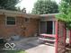 Brick patio with a picnic table and lattice at 4013 N Audubon Rd, Indianapolis, IN 46226