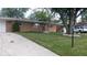 Brick ranch home with a large tree and neat lawn at 4013 N Audubon Rd, Indianapolis, IN 46226