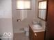 Bathroom with a toilet, sink, and shower/tub combo at 4013 N Audubon Rd, Indianapolis, IN 46226