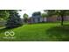 View of the house from the backyard, lush green grass at 4013 N Audubon Rd, Indianapolis, IN 46226
