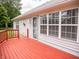 Red deck with access to the home and a view of the backyard at 11613 Coastal Dr, Indianapolis, IN 46229