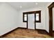 Entryway with hardwood floors and white front door at 3634 N Kenwood Ave, Indianapolis, IN 46208