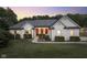 Charming white brick home with a welcoming front porch at 5181 S Poplar Dr, Columbus, IN 47201