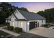 Modern two-car garage with black and glass doors at 5181 S Poplar Dr, Columbus, IN 47201