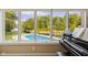 Lake view from sunroom, showcasing a private pool and tranquil landscape at 5181 S Poplar Dr, Columbus, IN 47201