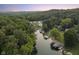 Aerial view of lakefront home and neighborhood at sunset at 5181 S Poplar Dr, Columbus, IN 47201