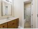 Clean bathroom with wood vanity, large mirror, and bathtub at 5181 S Poplar Dr, Columbus, IN 47201