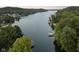 Aerial view of lakefront property with lush greenery and private boat docks at 5181 S Poplar Dr, Columbus, IN 47201