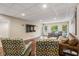 Spacious finished basement with large screen TV, comfortable seating, and hardwood floors at 5181 S Poplar Dr, Columbus, IN 47201