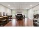 Basement game room with shuffleboard, fireplace, and seating at 5181 S Poplar Dr, Columbus, IN 47201