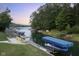 Private dock with boat and seating overlooking calm lake waters at 5181 S Poplar Dr, Columbus, IN 47201