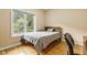 Bright bedroom with a comfortable bed and large window at 5181 S Poplar Dr, Columbus, IN 47201