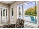 Basement seating area with large windows overlooking the pool and backyard at 5181 S Poplar Dr, Columbus, IN 47201