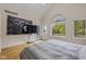 Main bedroom with hardwood floors, large windows, and city view at 5181 S Poplar Dr, Columbus, IN 47201