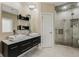 Modern bathroom with double vanity, glass shower, and elegant tile work at 5181 S Poplar Dr, Columbus, IN 47201
