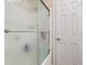 Bathroom with a shower and textured glass door at 5181 S Poplar Dr, Columbus, IN 47201